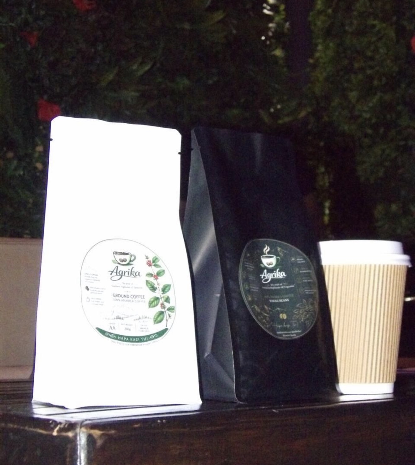 Agrika ground coffee and whole beans packages with coffee cup
